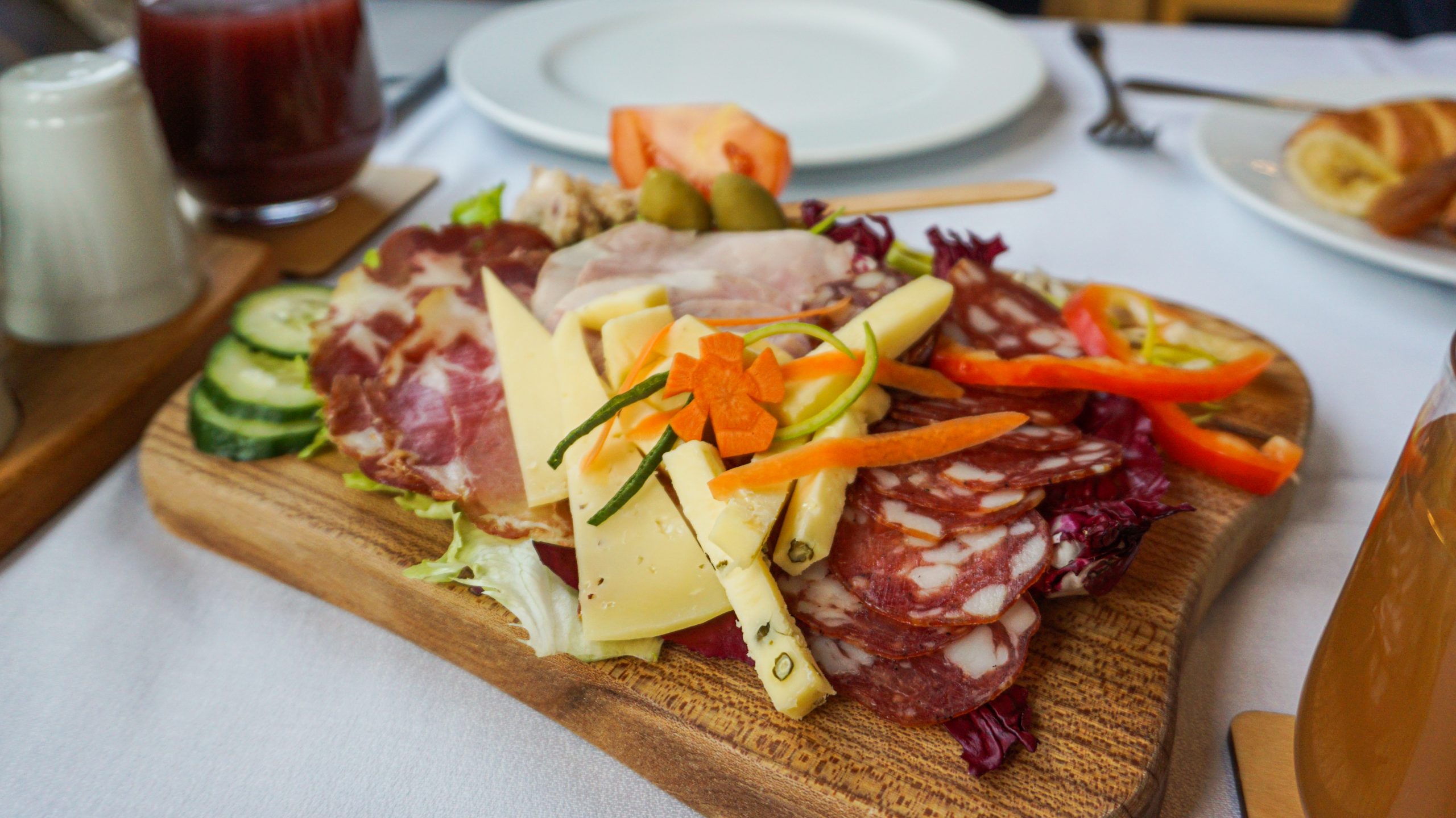 A cheese and meat platter at the breakfast of Villa Triglav Hotel
