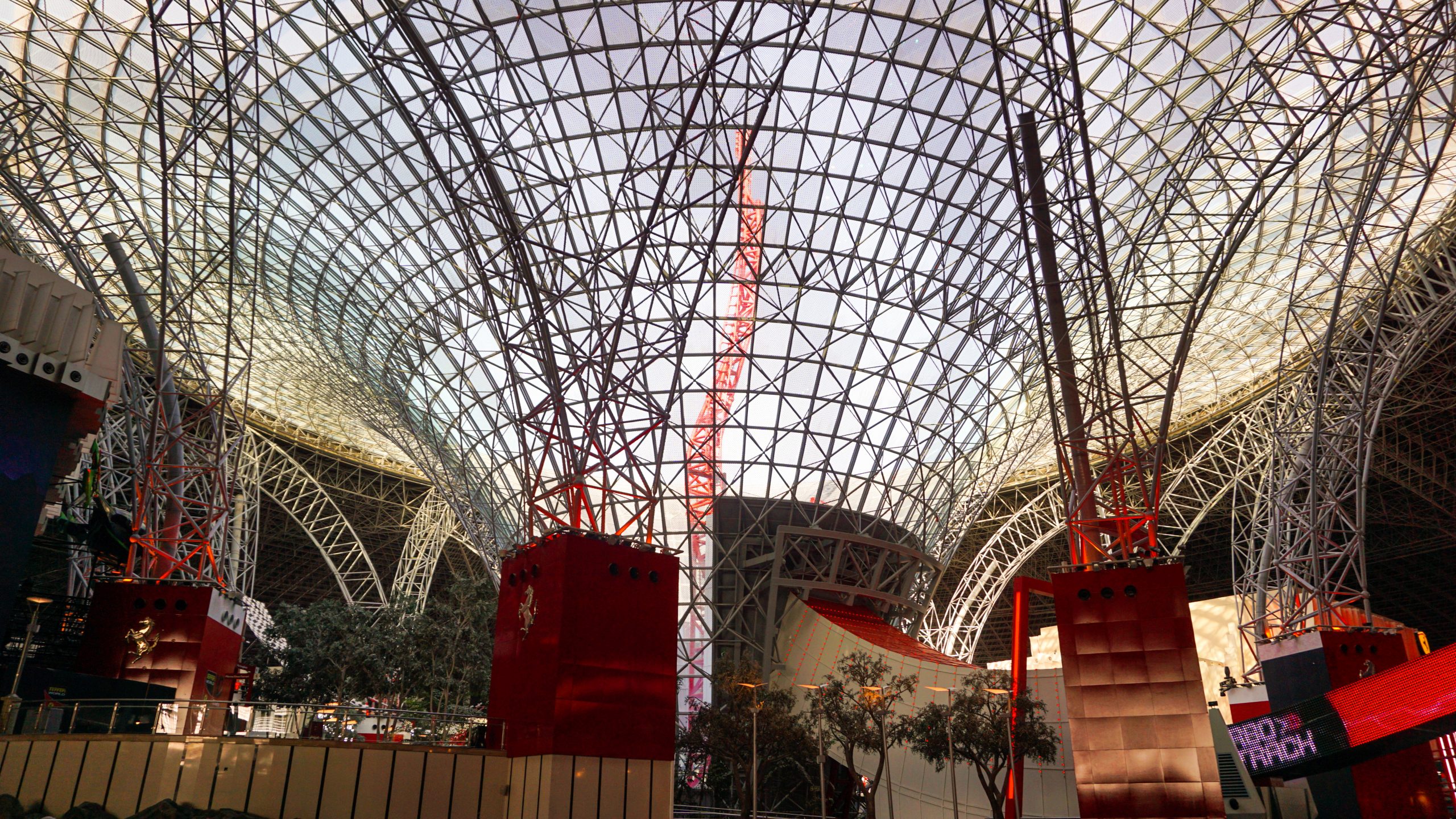 Interior of Ferrari World Abu Dhabi and the Turbo Track ride at the background