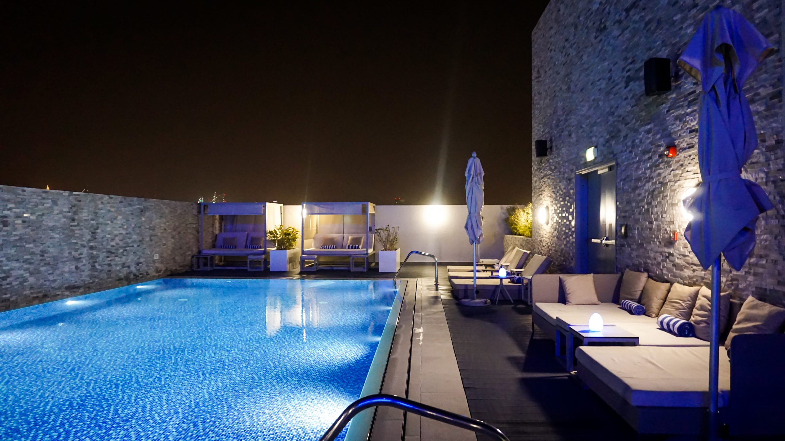 The rooftop pool and some loungers at Novotel Bur Dubai Hotel