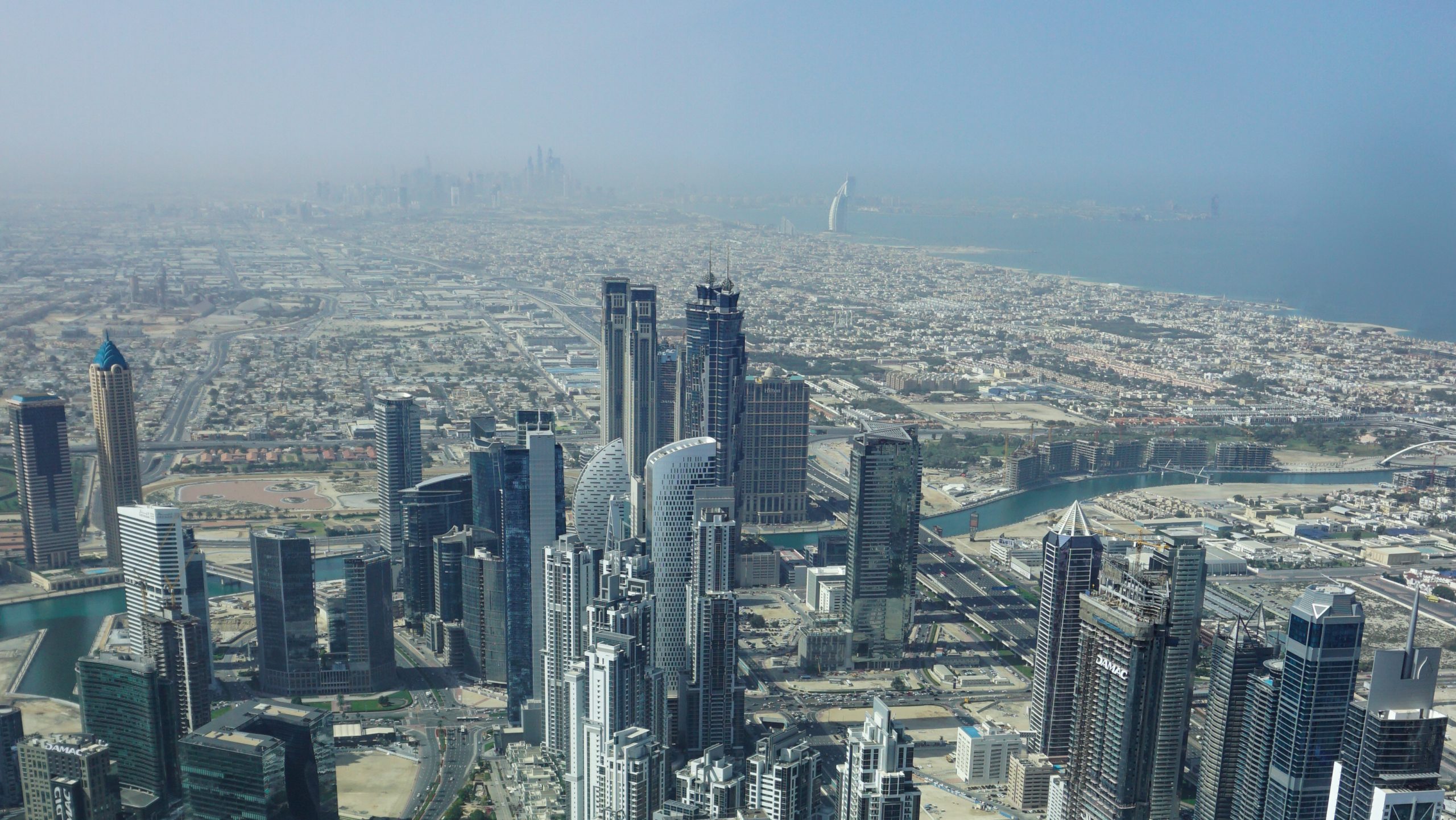 View of Burj Al Arab (in the distance) and other building from Burj Khalifa in Dubai Itinerary Day 2