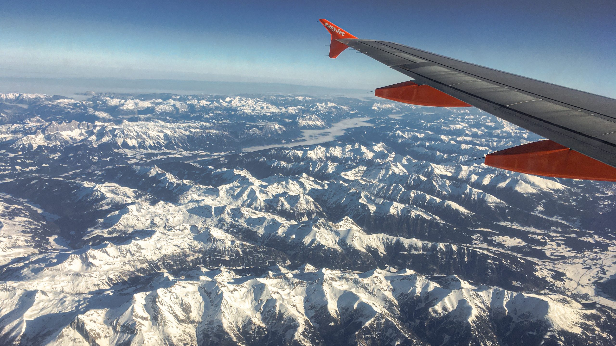 Snow-capped mountains as seen from the plan window seat