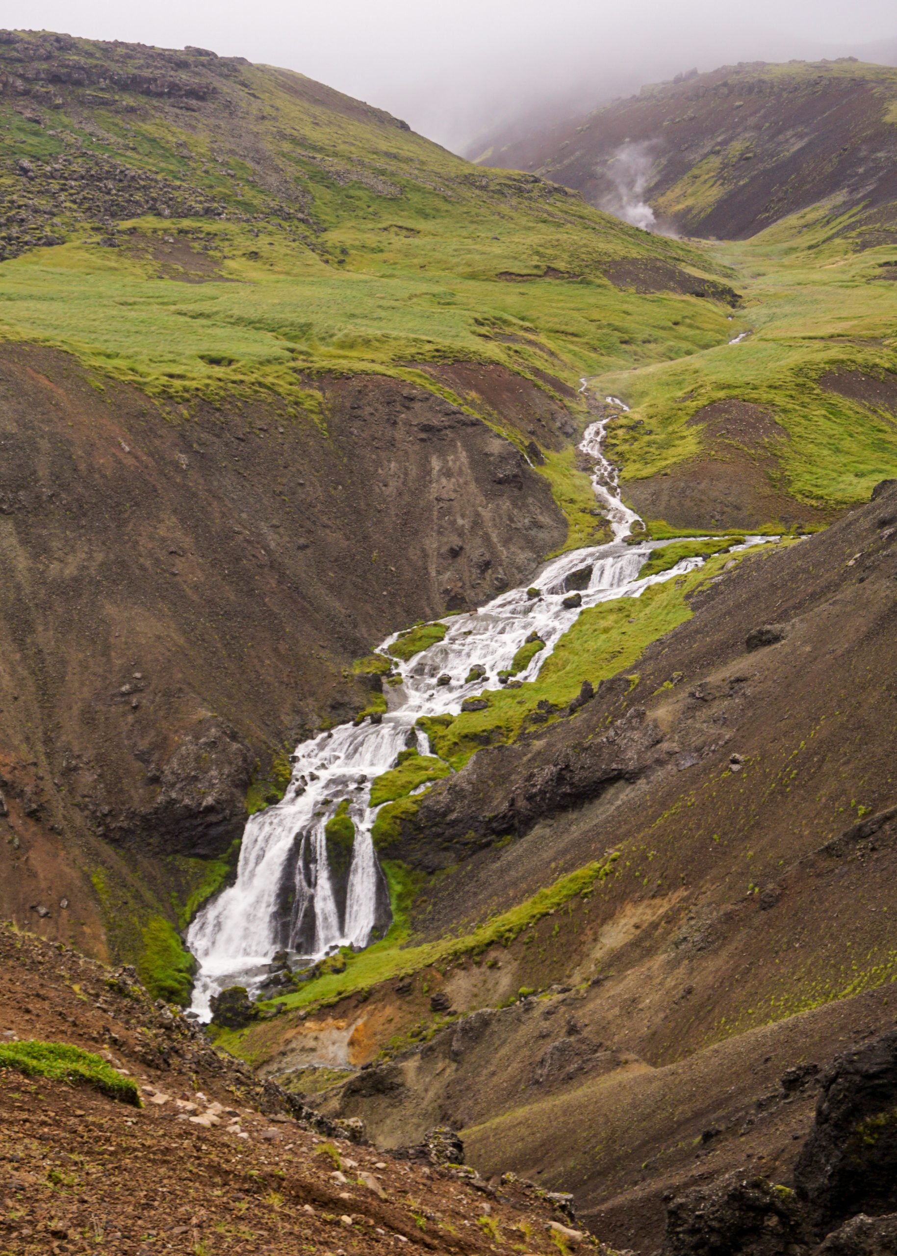A waterfall from a distance at the Reykjadalur Valley