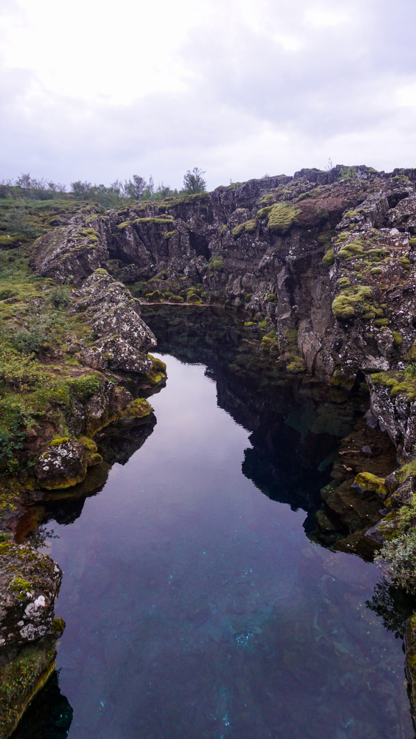 A small lagoon between two big rocks at Thingvellir National Park