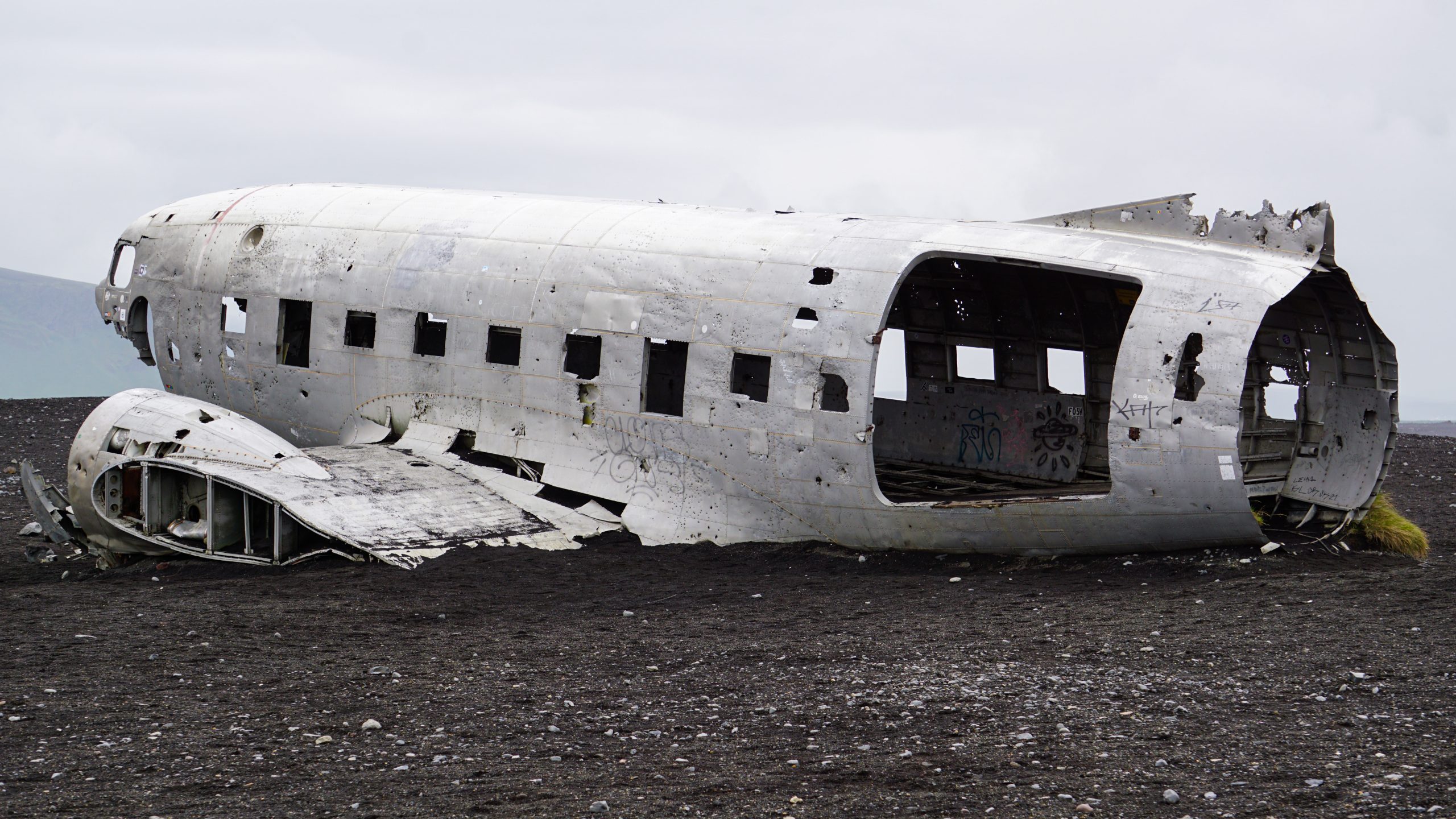 An airplane wreckage on a black sand beach in Iceland
